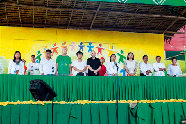 The visitors were given seats of honor on the grandstand at the opening of the Organic and Cultural Festival.